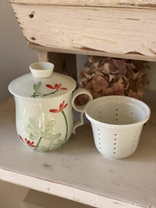 Pretty porcelain teacup and infuser candle